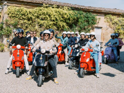 Event guests on a Vespa tour at Villa Catignano