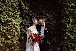 Amy and James, bride and groom with bouquet