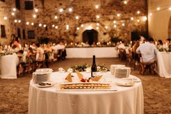Wedding reception dinner under string lights